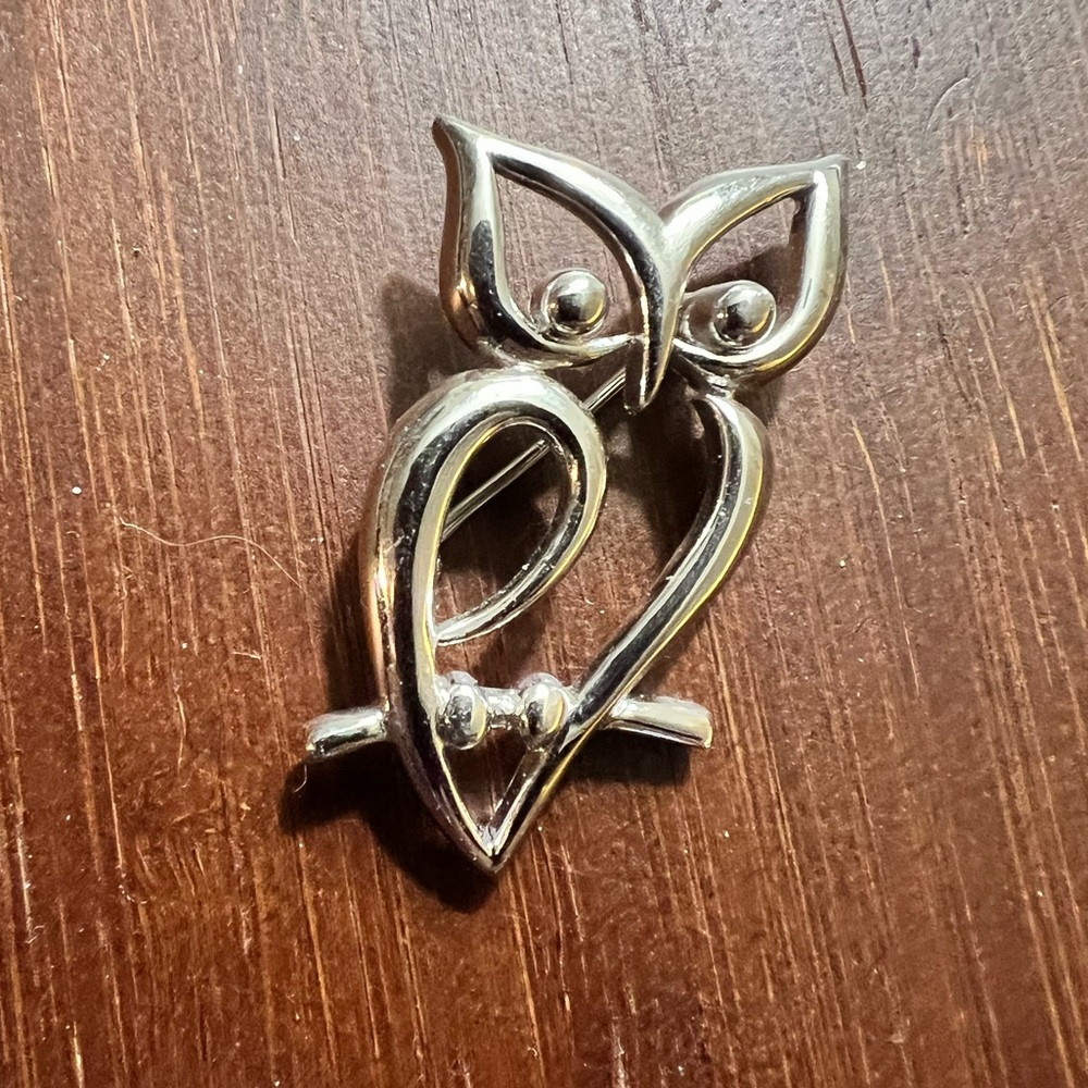 Signed Crown Trifari vintage open work silver tone abstract owl brooch.